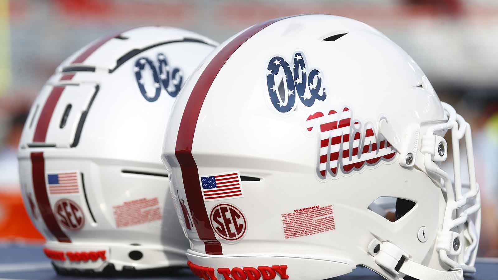 The Mississippi Rebels helmets with the American Flag Ole Miss Script logo on the sideline prior to the game against the Georgia Southern Eagles at Vaught-Hemingway Stadium.