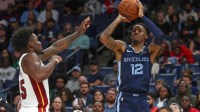 Memphis Grizzlies guard Ja Morant (12) shoots during the third quarter against the Miami Heat at FedExForum