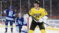Boston Bruins center Morgan Geekie (39) reacts after scoring a goal against the Tampa Bay Lightning during the first period in the 2026 Stadium Series ice hockey game at Raymond James Stadium.