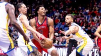 New Orleans Pelicans guard Trey Murphy III (25) dribbles against Golden State Warriors guard Stephen Curry (30) during first half at Smoothie King Center.