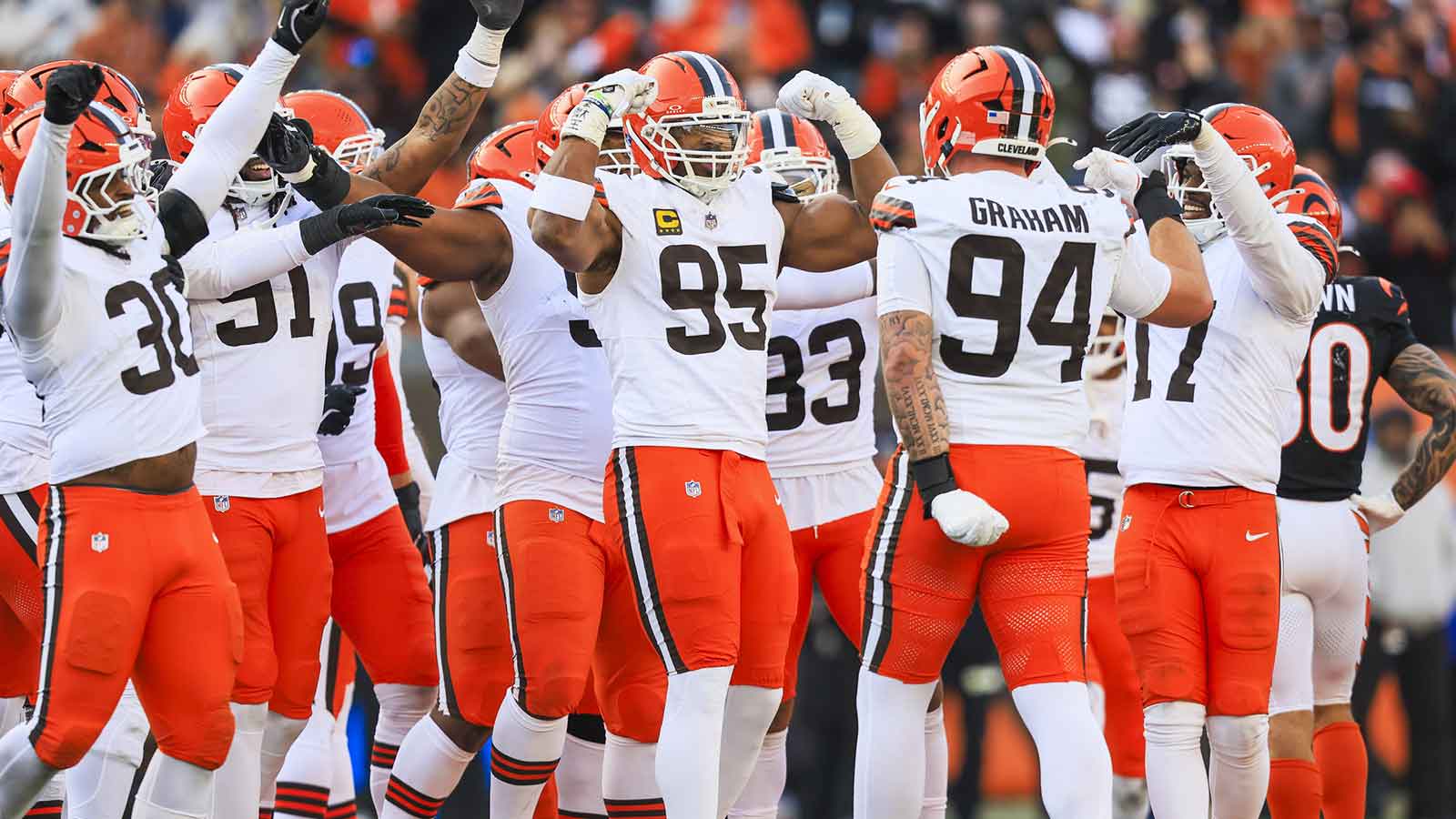 Cleveland Browns defensive end Myles Garrett (95) celebrates with teammates following a sack against the Cincinnati Bengals during the fourth quarter at Paycor Stadium. The play set a new NFL single season sack record by Garrett.