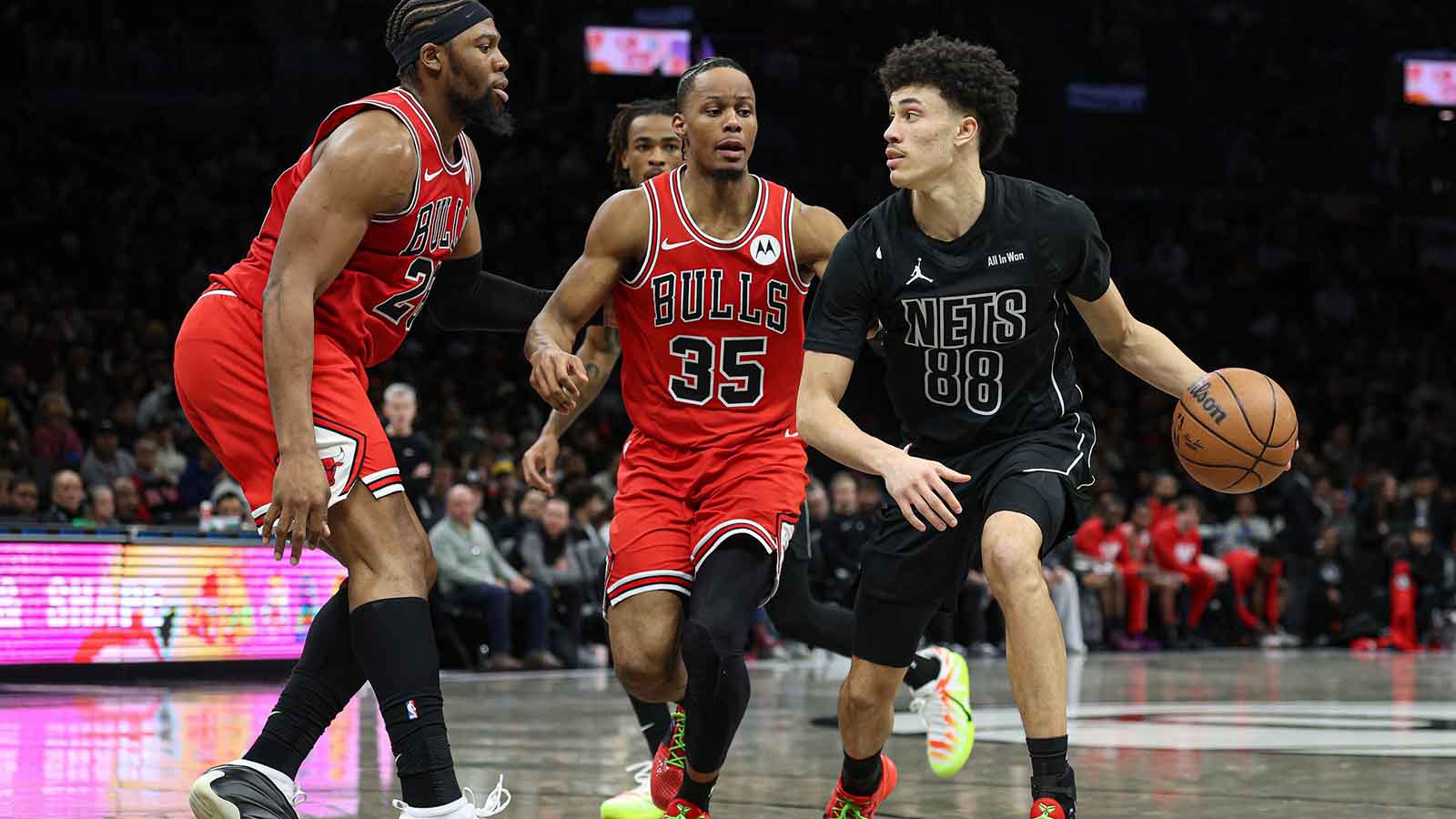 Brooklyn Nets guard Nolan Traore (88) is guarded by Chicago Bulls forward Isaac Okoro (35) and forward Guerschon Yabusele (28) during the second half at Barclays Center.