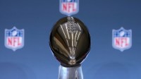 The Vince Lombardi trophy at Super Bowl LX press conference at San Jose Convention Center.