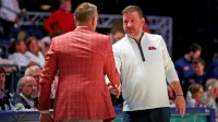 Mississippi Rebels head coach Chris Beard (right) shakes hands with Alabama Crimson Tide head coach Nate Oats (left) after the game at The Sandy and John Black Pavilion at Ole Miss.