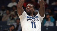 Minnesota Timberwolves center Naz Reid (11) shoots for three during the fourth quarter against the Memphis Grizzlies at FedExForum. Mandatory Credit: Petre Thomas-Imagn Images