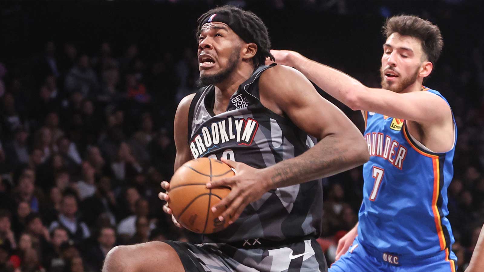 Nets center Day'Ron Sharpe (20) grabs a rebound in the fourth quarter against the Oklahoma City Thunder at Barclays Center