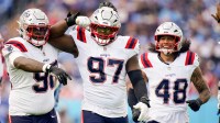 New England Patriots defensive end Milton Williams (97) celebrates sacking Tennessee Titans quarterback Cam Ward (1) during the third quarter at Nissan Stadium in Nashville, Tenn., Sunday, Oct. 19, 2025.