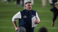 New England Patriots head coach Mike Vrabel runs on the field after the game against the Seattle Seahawks in Super Bowl LX at Levi's Stadium.