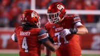 Utah Utes quarterback Devon Dampier (4) celebrates scoring a touchdown against the Arizona State Sun Devils with Utah Utes offensive lineman Caleb Lomu (71) during the second quarter at Rice-Eccles Stadium.