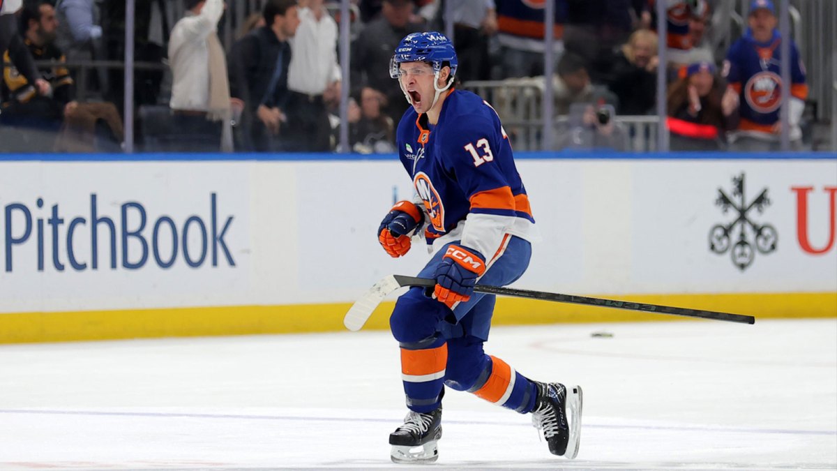 New York Islanders center Mathew Barzal (13) celebrates his goal against the Pittsburgh Penguins during the third period at UBS Arena