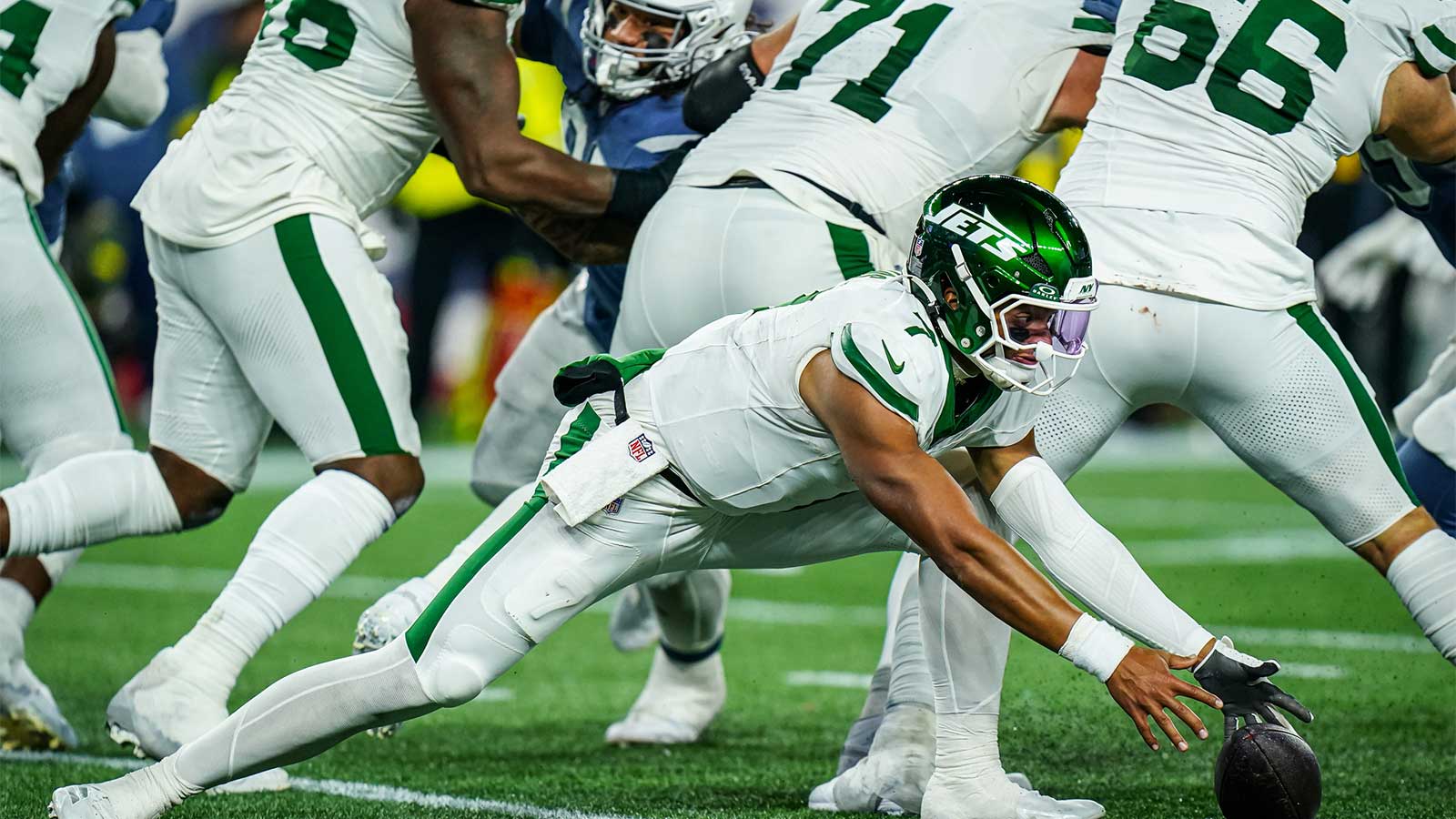 New York Jets quarterback Justin Fields (7) looses the ball on the snap against the New England Patriots in the fourth quarter at Gillette Stadium.