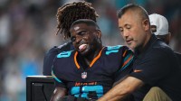 Miami Dolphins wide receiver Tyreek Hill (10) is tended to by medical staff after injuring his leg against the New York Jets during the second half at Hard Rock Stadium. Mandatory Credit: Rich Storry-Imagn Images