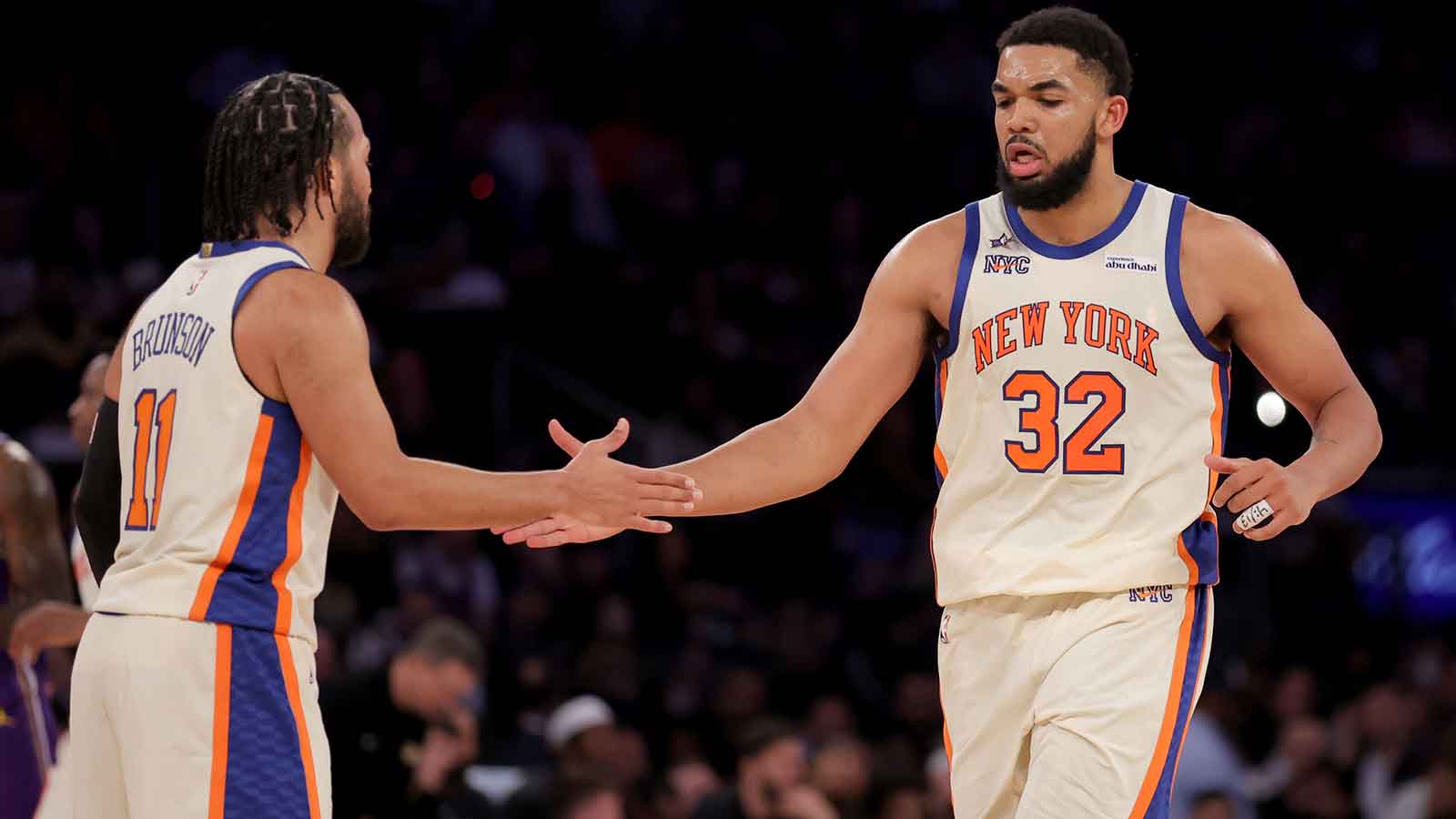 New York Knicks center Karl-Anthony Towns (32) high fives guard Jalen Brunson (11) during the third quarter against the Los Angeles Lakers at Madison Square Garden.