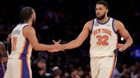 New York Knicks center Karl-Anthony Towns (32) high fives guard Jalen Brunson (11) during the third quarter against the Los Angeles Lakers at Madison Square Garden.