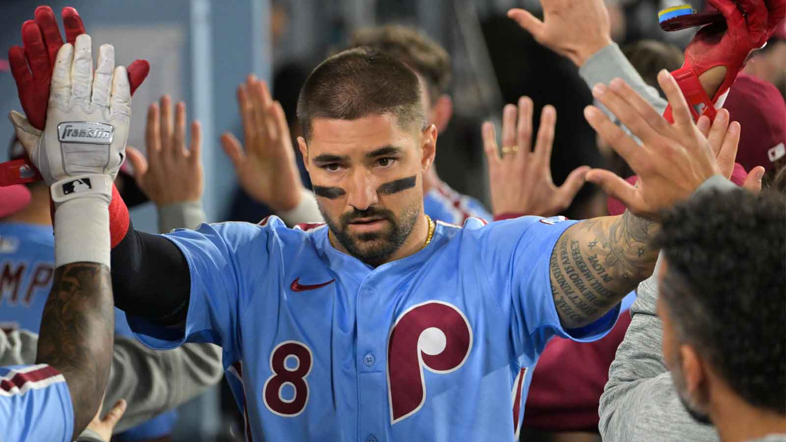 Philadelphia Phillies right fielder Nick Castellanos (8) celebrates after scoring a run during the eighth inning against the Los Angeles Dodgers during game three of the NLDS round for the 2025 MLB playoffs at Dodger Stadium