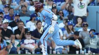 Philadelphia Phillies right fielder Nick Castellanos (8) hits a RBI double in the seventh inning against the Los Angeles Dodgers during game four of the NLDS round for the 2025 MLB playoffs at Dodger Stadium.