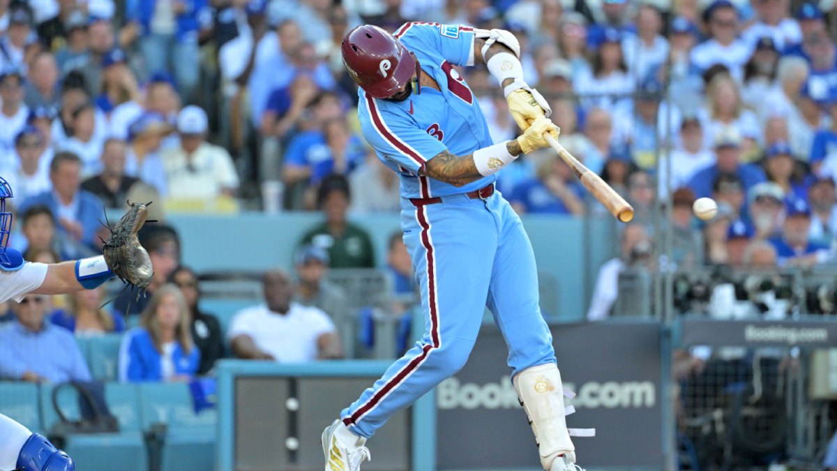 Philadelphia Phillies right fielder Nick Castellanos (8) hits a RBI double in the eighth inning against the Los Angeles Dodgers during game four of the NLDS round for the 2025 MLB playoffs at Dodger Stadium.