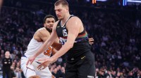 Denver Nuggets center Nikola Jokic (15) drives past New York Knicks center Karl-Anthony Towns (32) in the first quarter at Madison Square Garden. Mandatory Credit: Wendell Cruz-Imagn Images
