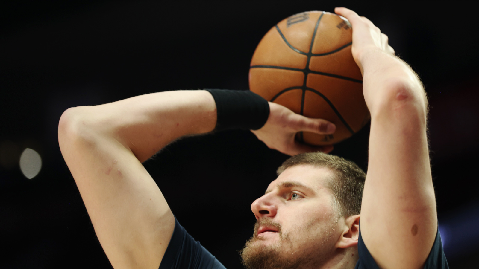 Denver Nuggets center Nikola Jokic (15) shoots during warm ups before a game against the Portland Trail Blazers at Moda Center.