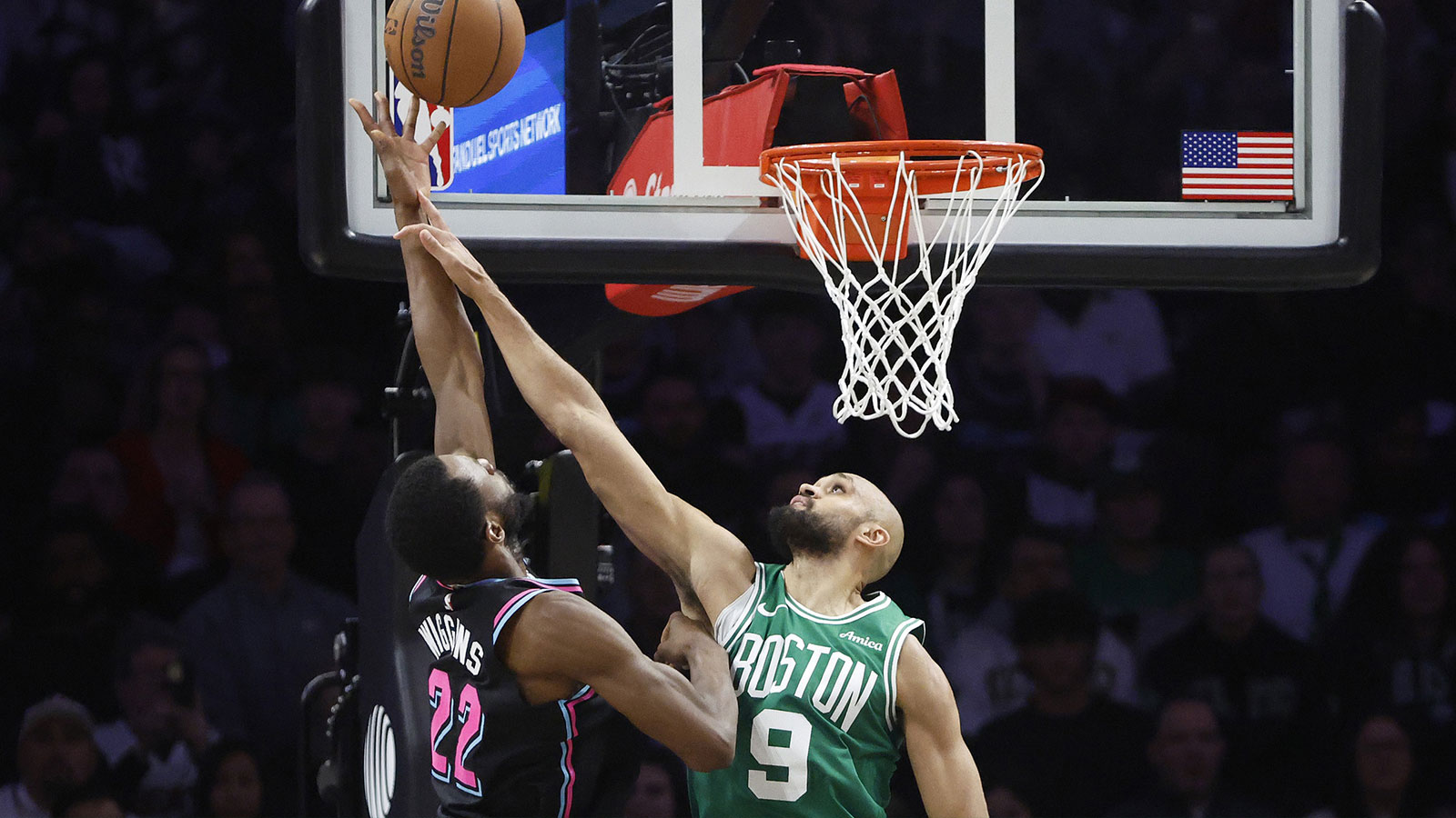 Boston Celtics guard Derrick White (9) defends against Miami Heat forward Andrew Wiggins (22) during the second half at Kaseya Center.