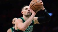 Boston Celtics center Nikola Vucevic (4) shoots a free throw during the second half against the Miami Heat at TD Garden.