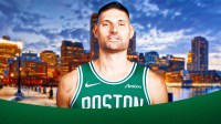 nikola vucevic in celtics uniform boston background