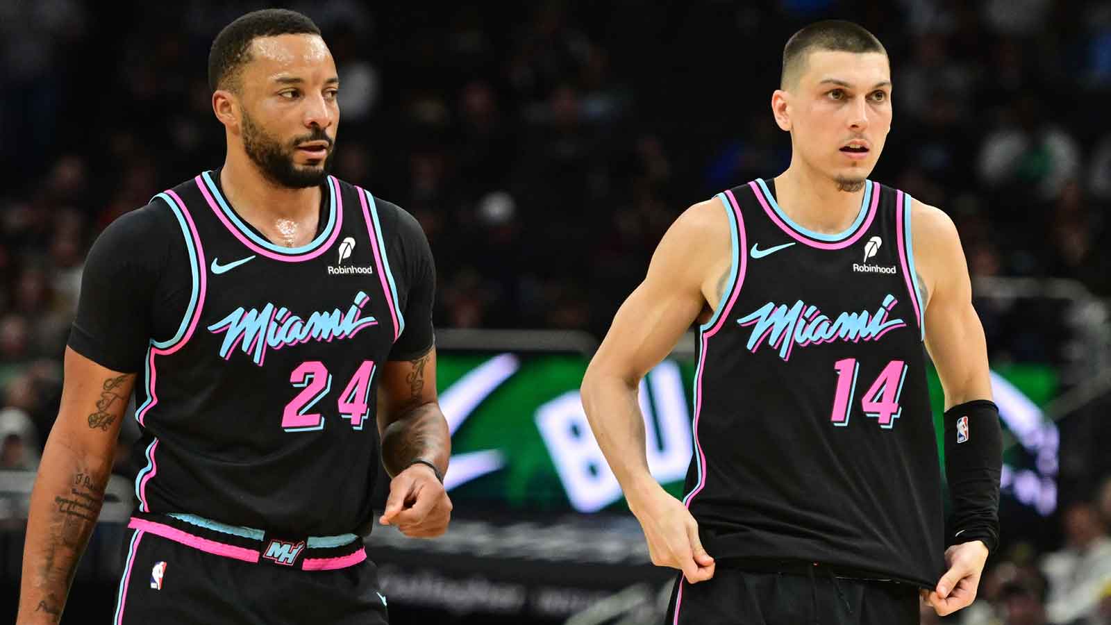 Miami Heat guard Norman Powell (24) and guard Tyler Herro (14) looks on in the third quarter against the Milwaukee Bucks at Fiserv Forum.