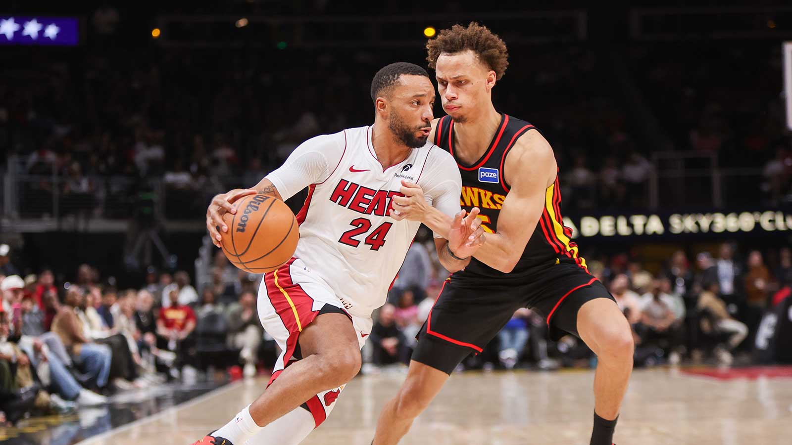 Miami Heat guard Norman Powell (24) drives on Atlanta Hawks guard Dyson Daniels (5) in the second quarter at State Farm Arena.