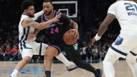 Miami Heat guard Norman Powell (24) drives to the basket as Memphis Grizzlies guard Scotty Pippen Jr. (1) defends during the second half at Kaseya Center.