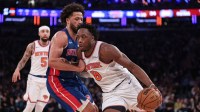 New York Knicks forward Og Anunoby (8) drives to the basket against Detroit Pistons guard Cade Cunningham (2) during the first half at Madison Square Garden.