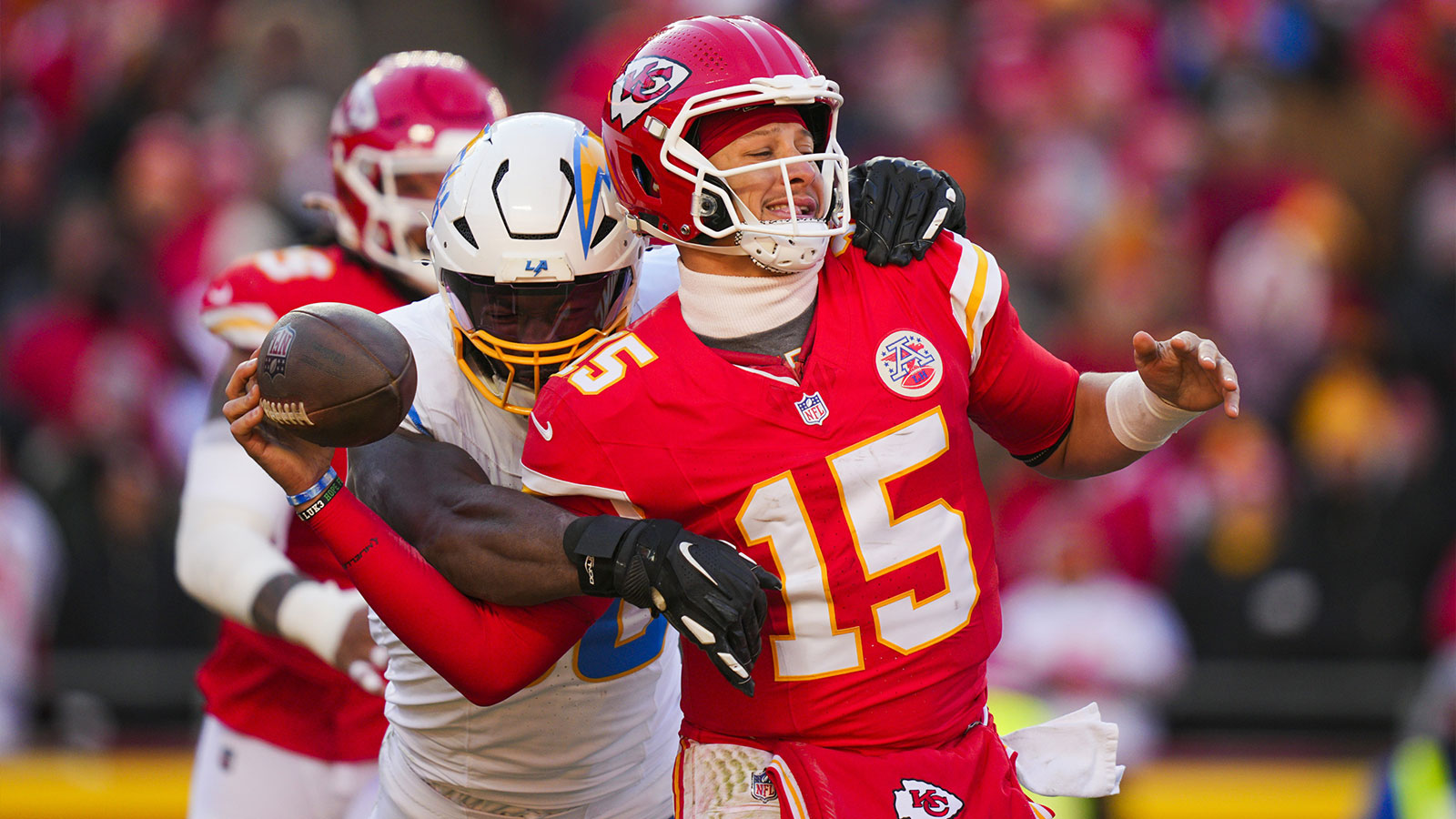 Los Angeles Chargers linebacker Odafe Oweh (98) sacks Kansas City Chiefs quarterback Patrick Mahomes (15) during the second half at GEHA Field at Arrowhead Stadium. 