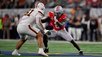 Miami Hurricanes offensive lineman Francis Mauigoa (61) blocks Ohio State Buckeyes linebacker Arvell Reese (8) during the 2025 Cotton Bowl and quarterfinal game of the College Football Playoff at AT&T Stadium.