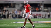Ohio State Buckeyes safety Caleb Downs (2) gets into position during the 2025 Cotton Bowl and quarterfinal game of the College Football Playoff at AT&T Stadium.