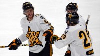 Team McDavid right wing David Pastrnak (88) of the Boston Bruins celebrates with Team McDavid center Leon Draisaitl (29) of the Edmonton Oilers in the 2024 NHL All-Star Game at Scotiabank Arena.
