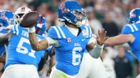 Mississippi Rebels quarterback Trinidad Chambliss (6) drops back to pass against the Miami Hurricanes in the first half during the 2026 Fiesta Bowl and semifinal game of the College Football Playoff at State Farm Stadium.