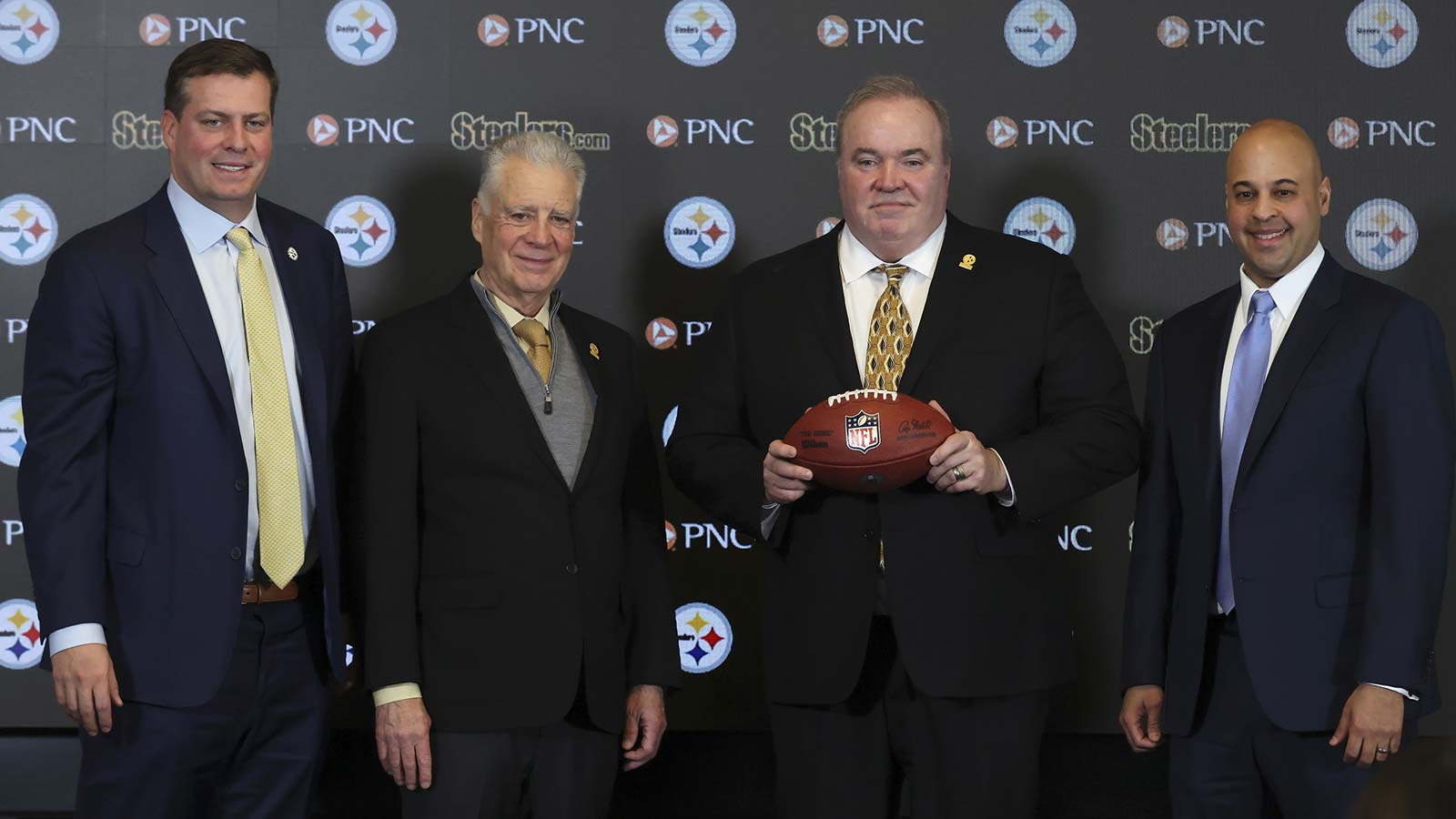 Daniel Martin Rooney (left), Pittsburgh Steelers owner Art Rooney II (left center) and general manager Omar Khan (right) flank Mike McCarthy (middle) at a press conference announcing McCarthy as the new Pittsburgh Steelers head coach at PNC Champions Club at Acrisure Stadium.