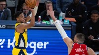 Indiana Pacers guard Tyrese Haliburton (0) shoots against LA Clippers center Ivica Zubac (40) in the first half at Gainbridge Fieldhouse.