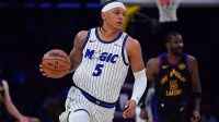 Orlando Magic forward Paolo Banchero (5) moves the ball up court against the Los Angeles Lakers during the first half at Crypto.com Arena.
