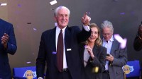 Los Angeles Lakers former coach Pat Riley and wife Chris Rodstrom watch as statue of Riley is unveiled at the Crypto.com Arena.