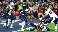 Feb 1, 2015; Glendale, AZ, USA; New England Patriots strong safety Malcolm Butler (21) celebrates with teammates after intercepting a pass against the Seattle Seahawks in the fourth quarter in Super Bowl XLIX at University of Phoenix Stadium. Mandatory Credit: Mark J. Rebilas-Imagn Images