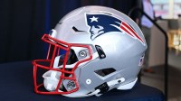A New England Patriots helmet sits on a table prior to a press conference at Gillette Stadium.