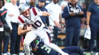 New England Patriots quarterback Drake Maye (10) runs against Seattle Seahawks safety Nick Emmanwori (3) during the first quarter in Super Bowl LX at Levi's Stadium.