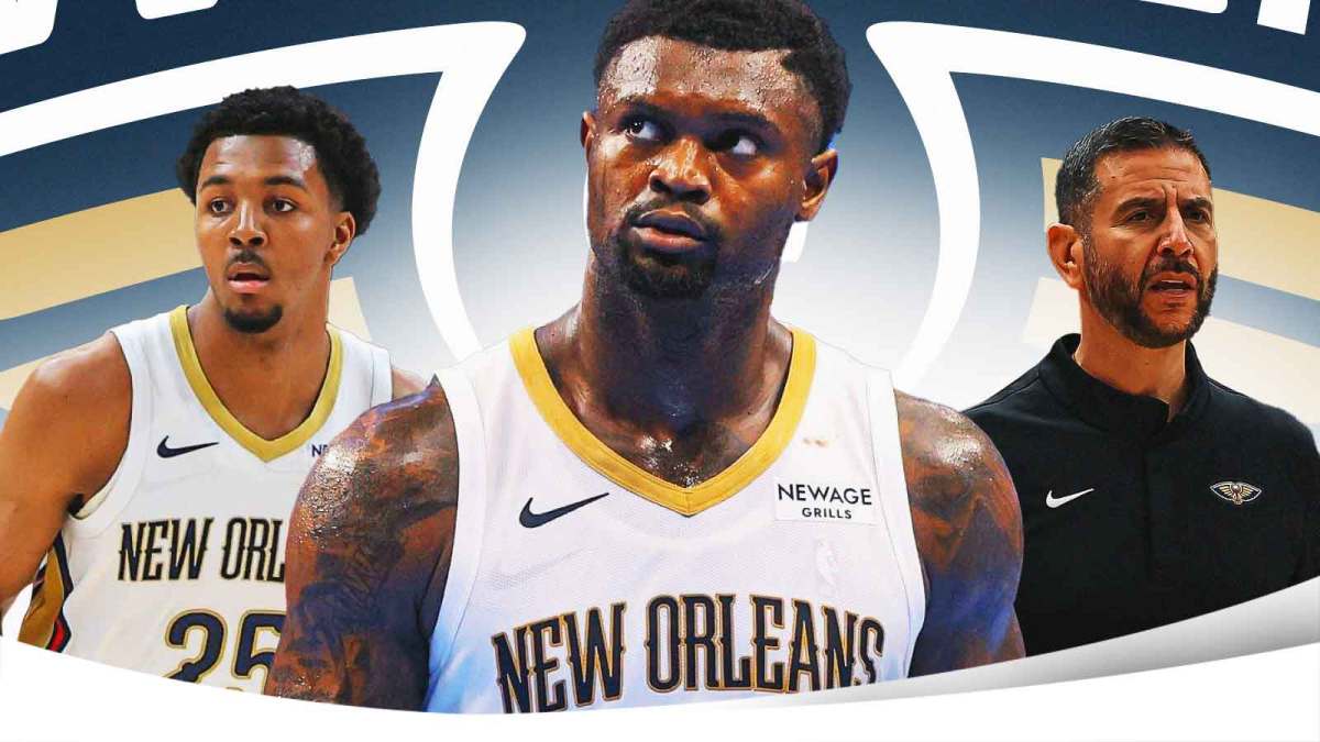 Zion Williamson in the middle, Coach James Borrego and Trey Murphy III around him, New Orleans Pelicans wallpaper in the background