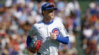 Chicago Cubs center fielder Pete Crow-Armstrong (4) runs back to the dugout during the first inning of a baseball game against the St. Louis Cardinals at Wrigley Field.