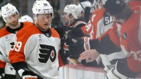 Philadelphia Flyers right wing Matvei Michkov (39) celebrates with the Flyers bench after scoring a goal against the Pittsburgh Penguins during the third period at PPG Paints Arena.