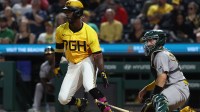Pittsburgh Pirates designated hitter Andrew McCutchen (22) hits a single against the Athletics during the seventh inning at PNC Park.