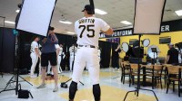 Pittsburgh Pirates infielder Konnor Griffin (75) poses for photos as he walks around to photo stations during media day at Pirate City.