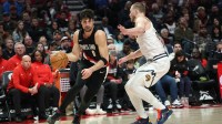 Portland Trail Blazers forward Deni Avdija (8) drives against Phoenix Suns guard Christian Braun (0) during the second half at Moda Center.