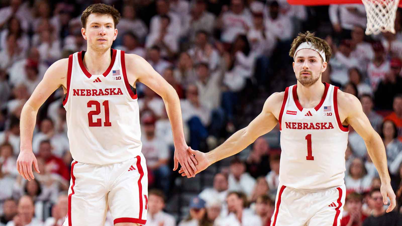 Nebraska Cornhuskers forward Pryce Sandfort (21) and guard Sam Hoiberg (1) celebrate after a three point shot against the Illinois Fighting Illini during the first half at Pinnacle Bank Arena.