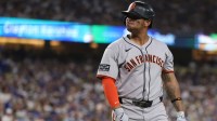 San Francisco Giants designated hitter Rafael Devers (16) reacts after striking out during the third inning against the Los Angeles Dodgers at Dodger Stadium.